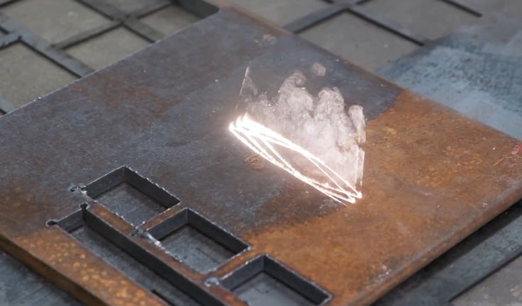 Laser cleaning removing rust from a steel plate